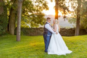 A stunning sunset wedding photo captured by a skilled South Wales photographer.