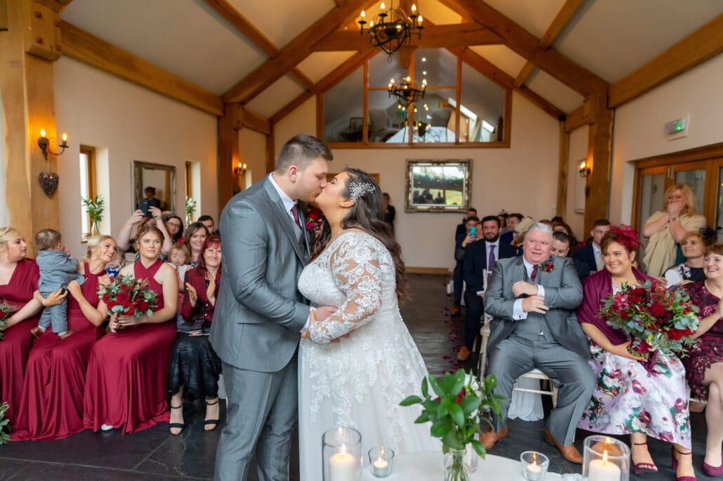 South Wales wedding photographer captures a heartwarming kiss between bride and groom.