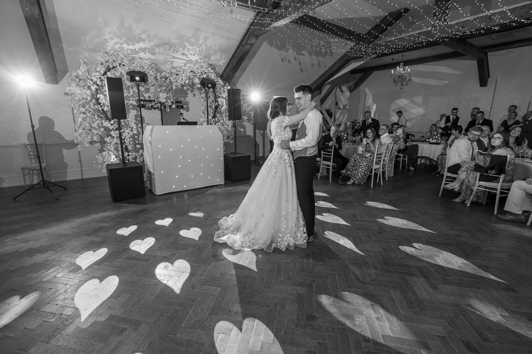 A bride and groom sharing their first dance at a wedding.