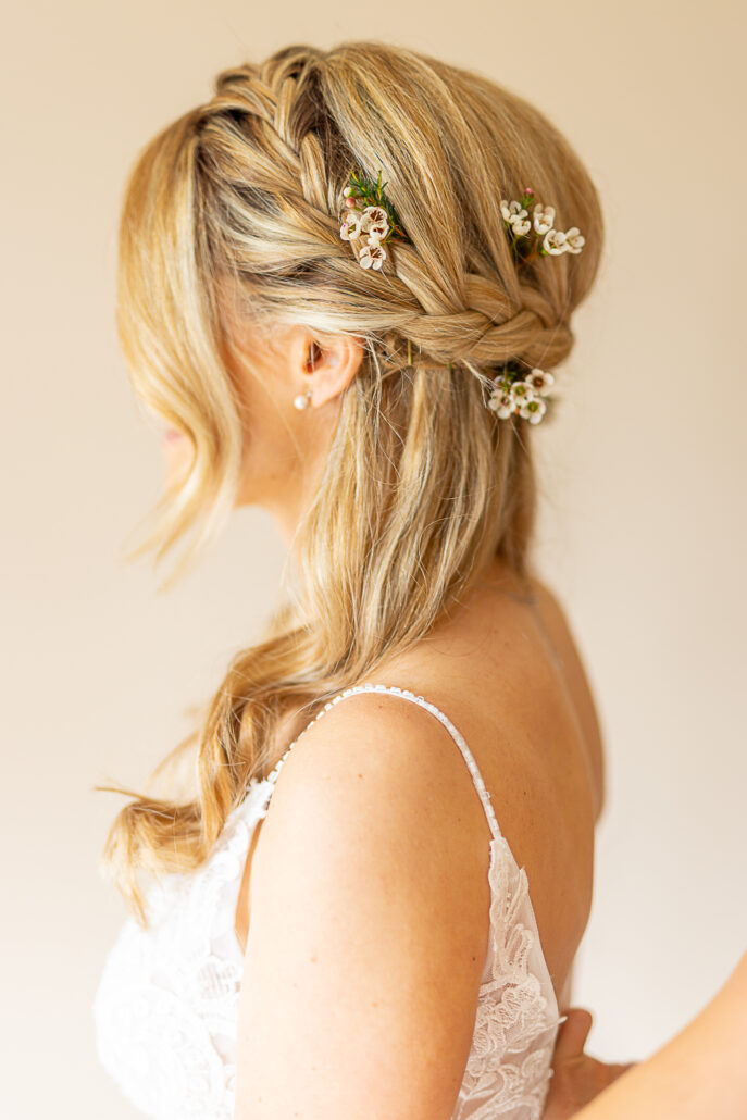 A bride with flowers in her hair.